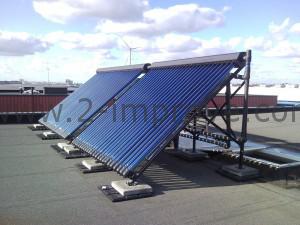 Deze zonnecollectoren staan op het dak bij ons op de zaak en verwarmen ons pand